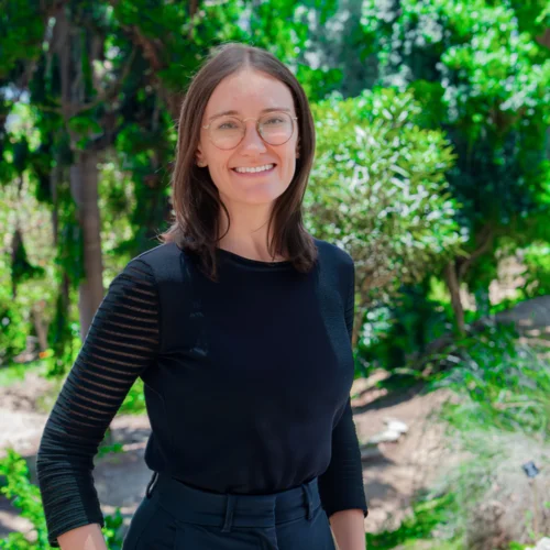 Headshot of Nicole Stephan smiling with trees in background